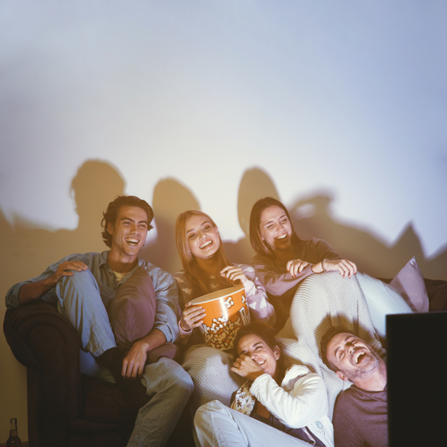 joyful-friends-having-movie-night_23-2147718318